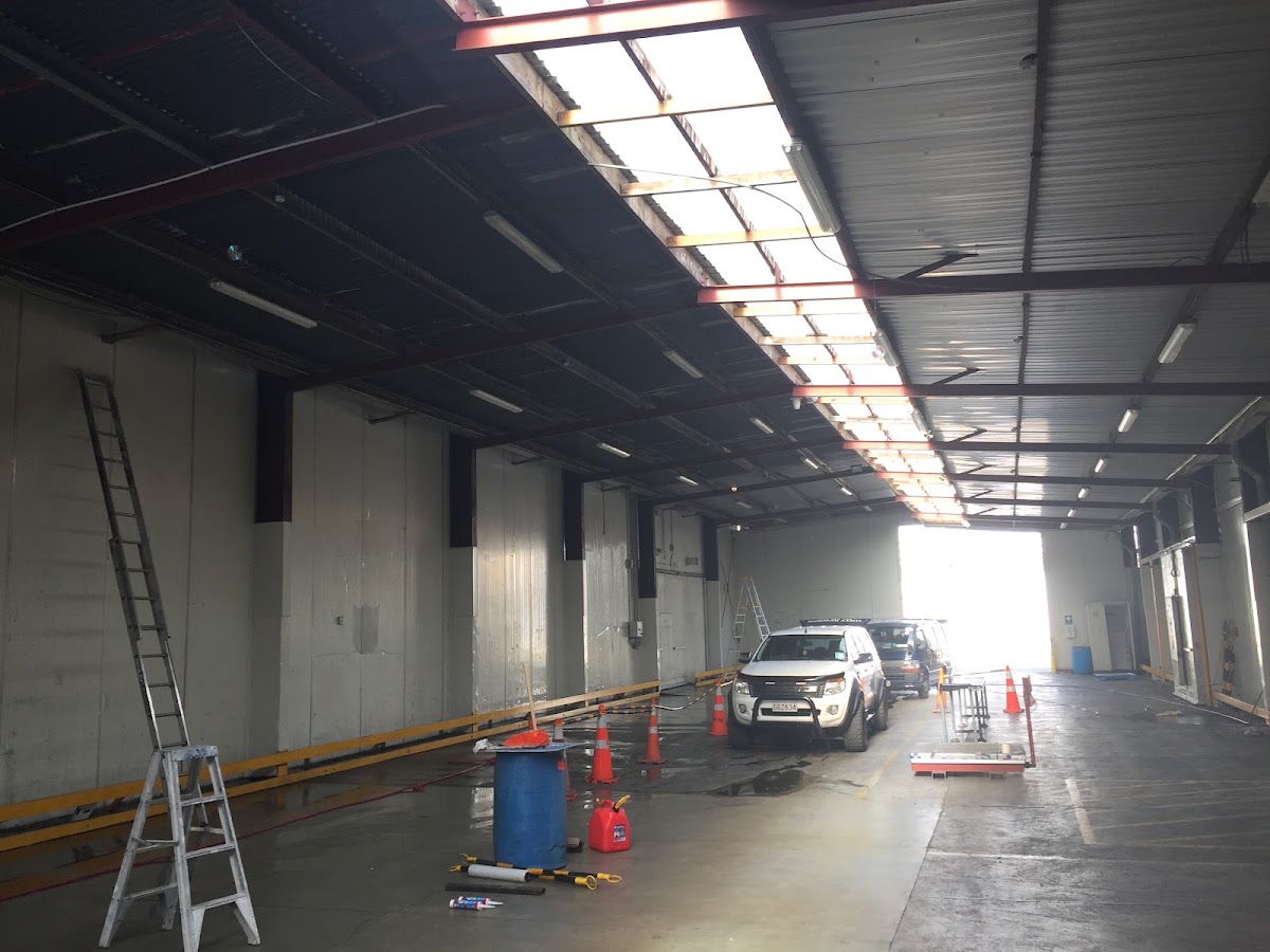 Commercial warehouse interior being repainted